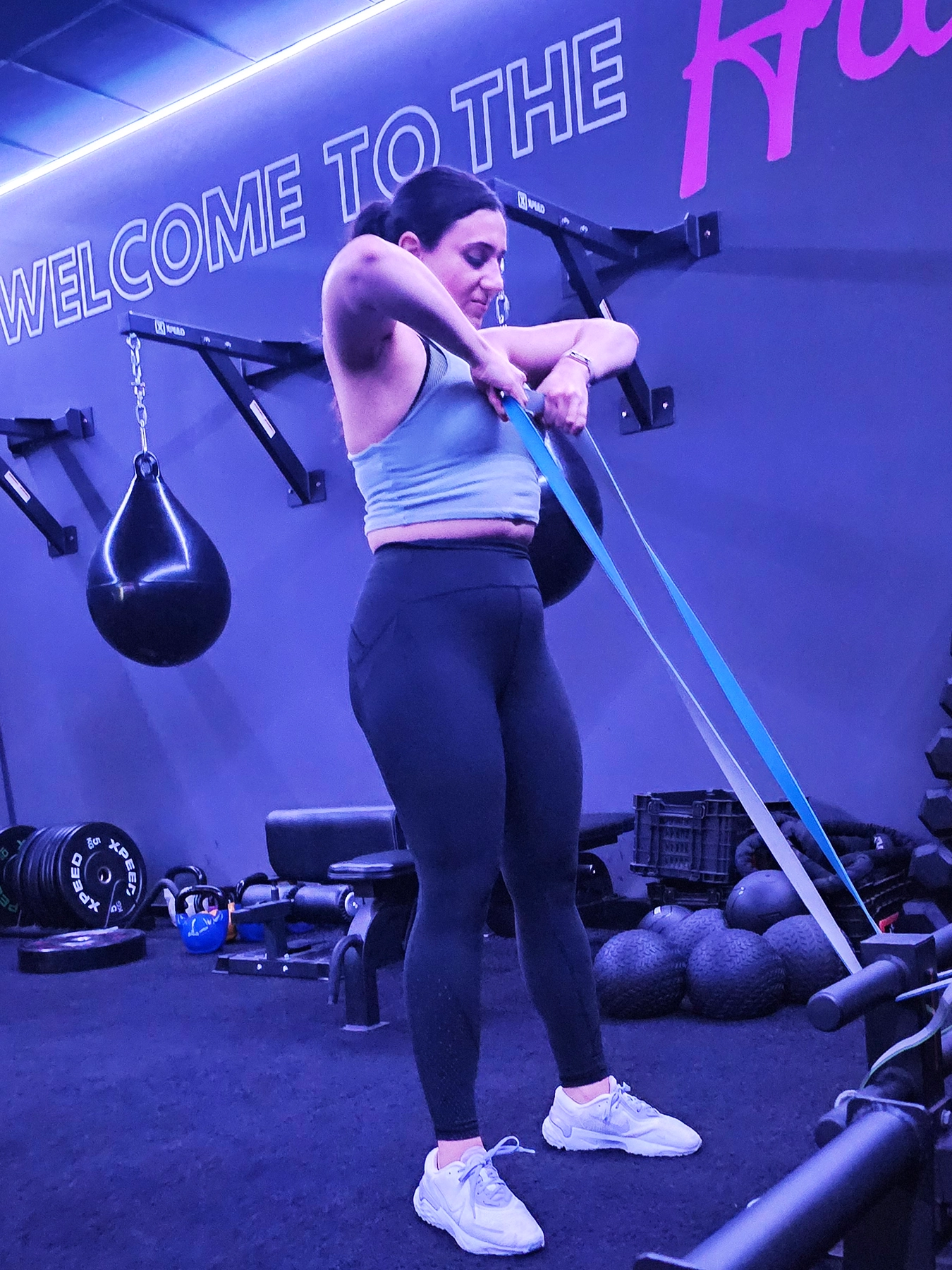 woman resistance training at the gym