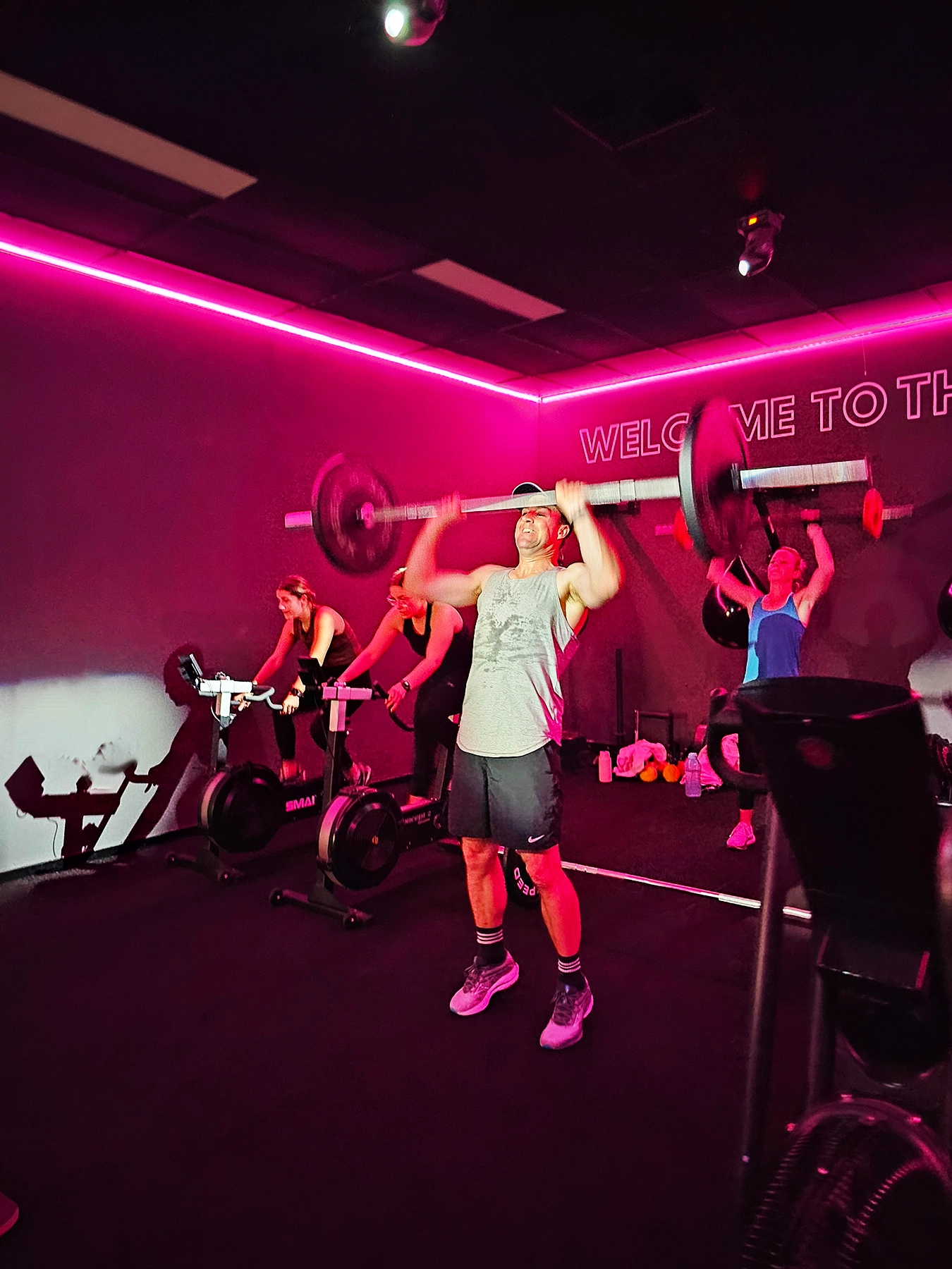 man lifting weights at the gym