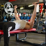man lifting weights